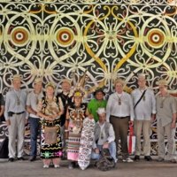 Posing in front of the Dayak traditional ornament